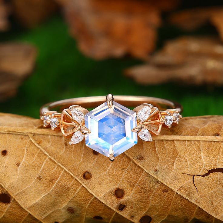 Engagement Ring Metal Type: 925 Sterling Silver, Soild 10k Gold, Solid 14k Gold, Solid 18k Gold Center Stone:  Moonstone Center Carat Weight: Flat Bottom Hexagon Cut 1.7CT (7mm) Side Stone:  Moissanite Side Carat Weight: 0.24ctw Band Width: 1.45mm SKU: YFXR0487-moonstone Accessories: *Shipped with beautiful ring box; *Directly price from Manufacturer, 1/3 the price from Jewelry Store; - Ethically Sourced Luxury Moonstone Ring With Diamond Accents, Luxury Adjustable Moonstone Ring For Weddings, Luxury Gold Moonstone Ring For Formal Occasions, Onyx Engagement Ring, Black Onyx Engagement Ring, Red Garnet Ring, Quartz Engagement Ring, Blue Topaz Engagement Ring, Black Engagement Ring