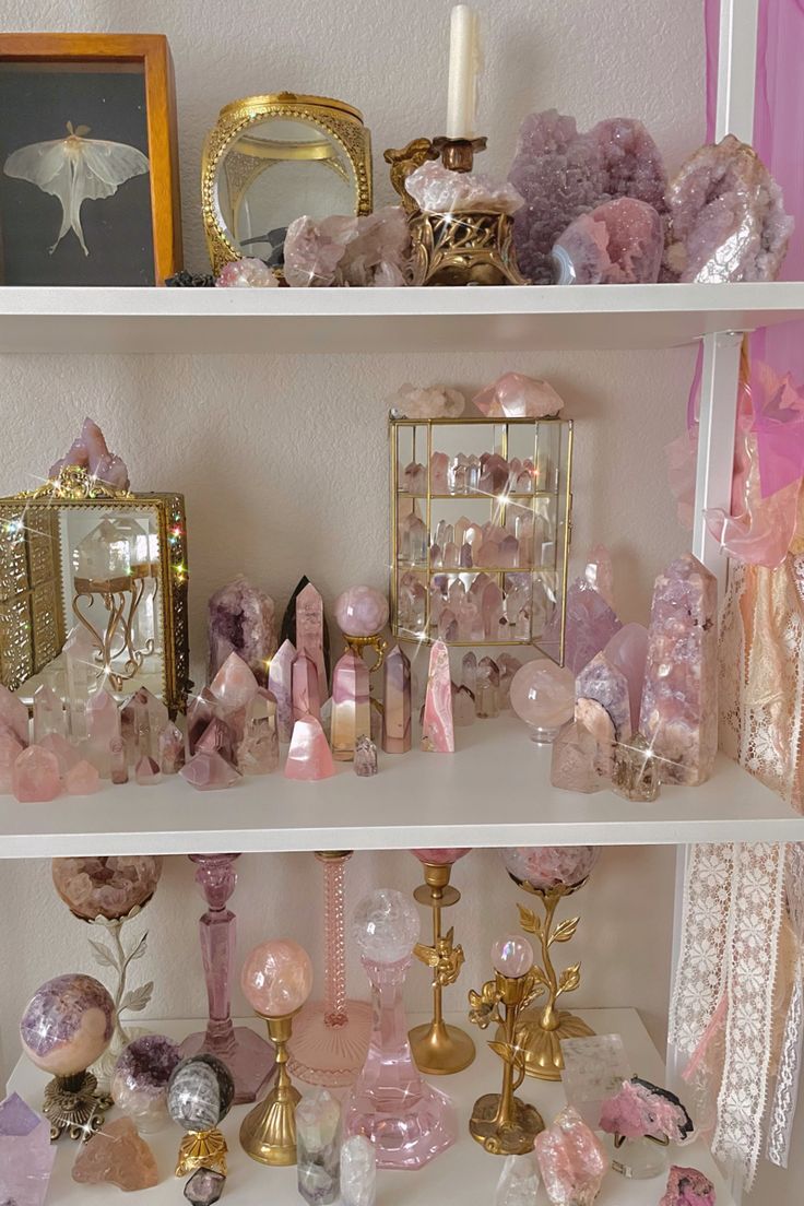 a shelf filled with lots of pink and gold items