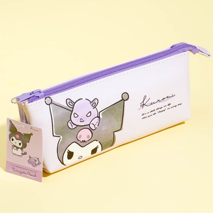 a white pencil case with an image of a cow on the front and purple trim