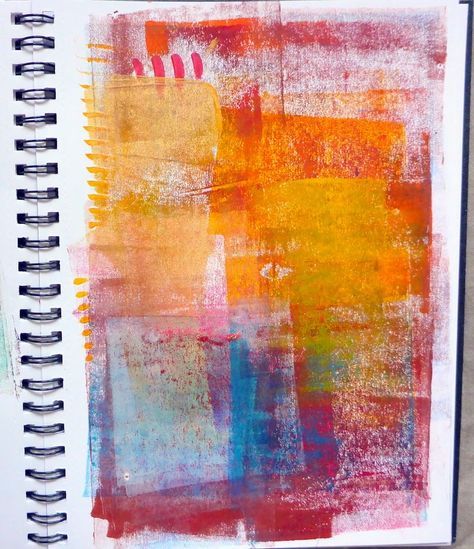 an art journal is open to show the inside pages, with different colors and shapes