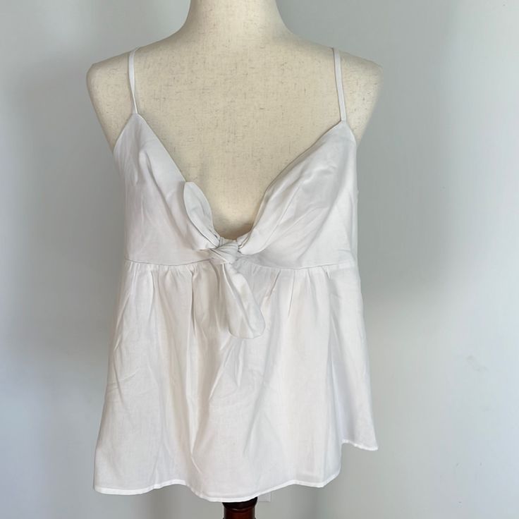 Nwt! White Color. Smocking On Back For Easy On And Off, Adjustable Straps. Pit To Pit 18”. Feminine Vacation Tops With Tie Straps, Feminine Tie Strap Tops For Vacation, Feminine Beach Tops With Tie Straps, Feminine Tops With Tie Straps For The Beach, Spring Daywear Tops With Tie Back, Chic White Top With Tie Straps, Casual V-neck Top With Tie Straps, Tie Back Tops For Spring Daywear, Spring Tie Back Tops For Daywear