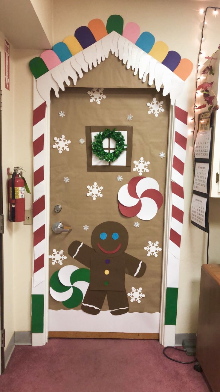 a door decorated with gingerbreads, snowflakes and candy canes