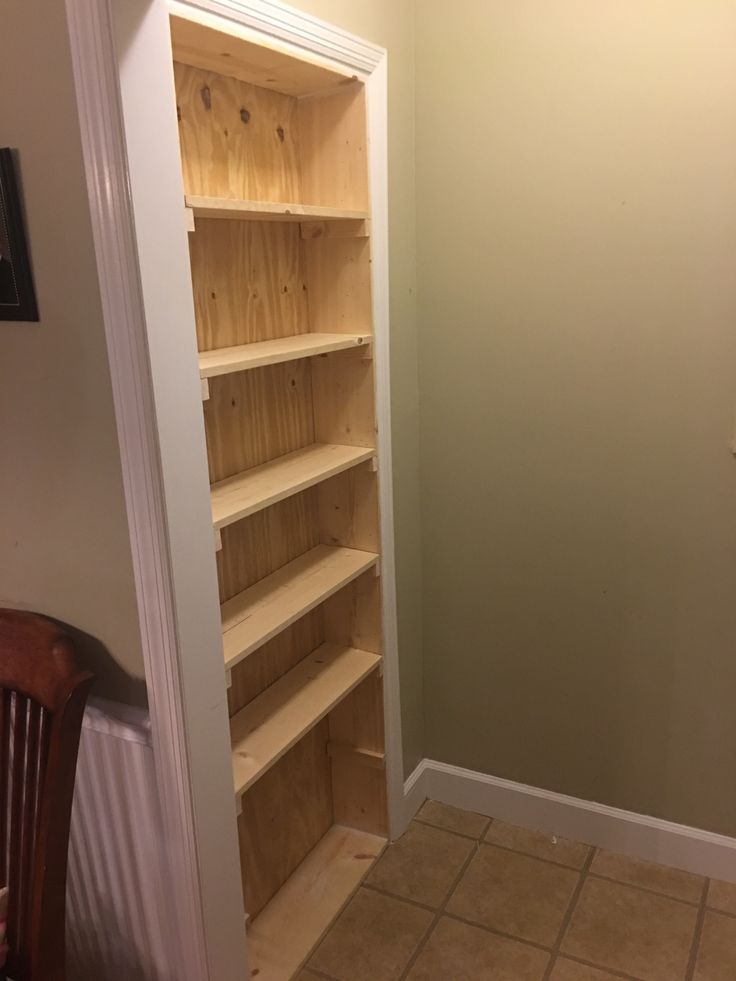 empty shelves in the corner of a room