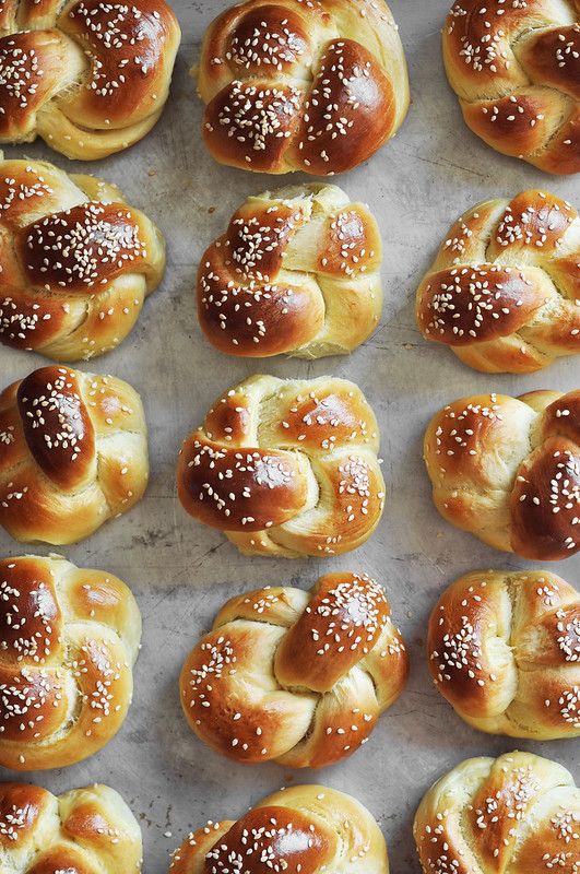 freshly baked pretzels on a baking sheet ready for the oven to be eaten