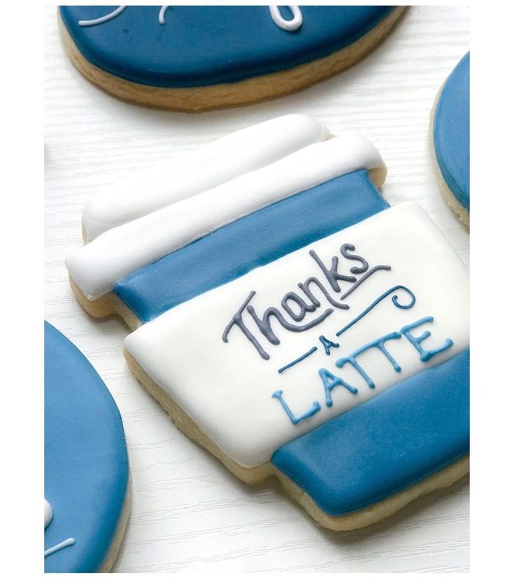 decorated cookies with thank you later written on the top and bottom one is blue and white