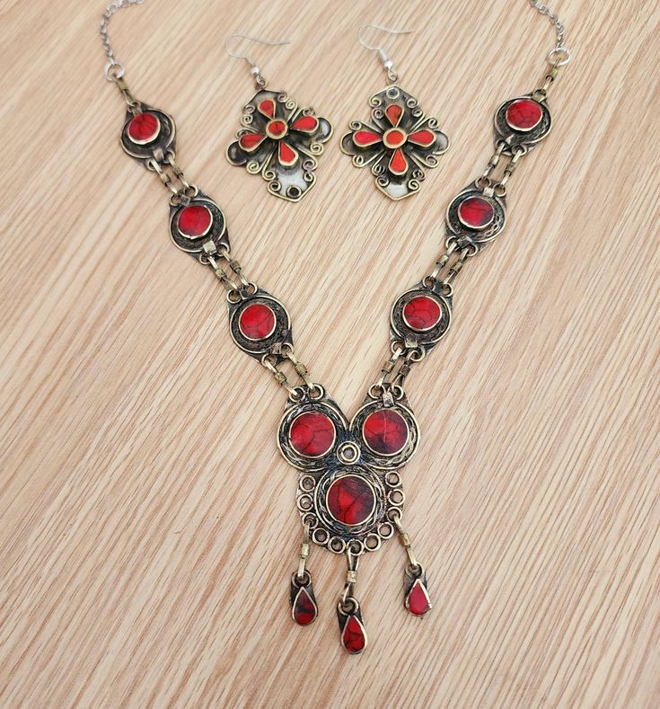 Boho Vintage necklace,afghan jewelry,bib necklace,statement,tribal red necklace,ethnic,gift for her,Kuchi jewelry,antique finish, size:20" beautiful vintage Afghan red traditional necklace. This tribal necklace is inspired by vintage kuchi jewelry. sets very well around the neck and looks amazing with any outfit. Bohemian Metal Bib Necklace As Gift, Bohemian Metal Bib Necklace As A Gift, Metal Bohemian Bib Necklace As A Gift, Bohemian Style Metal Bib Necklace As Gift, Bohemian Metal Bib Necklace, Traditional Red Necklaces With Jewels, Traditional Red Dangle Necklace, Traditional Red Necklace With Jewels, Red Bohemian Nickel-free Necklace