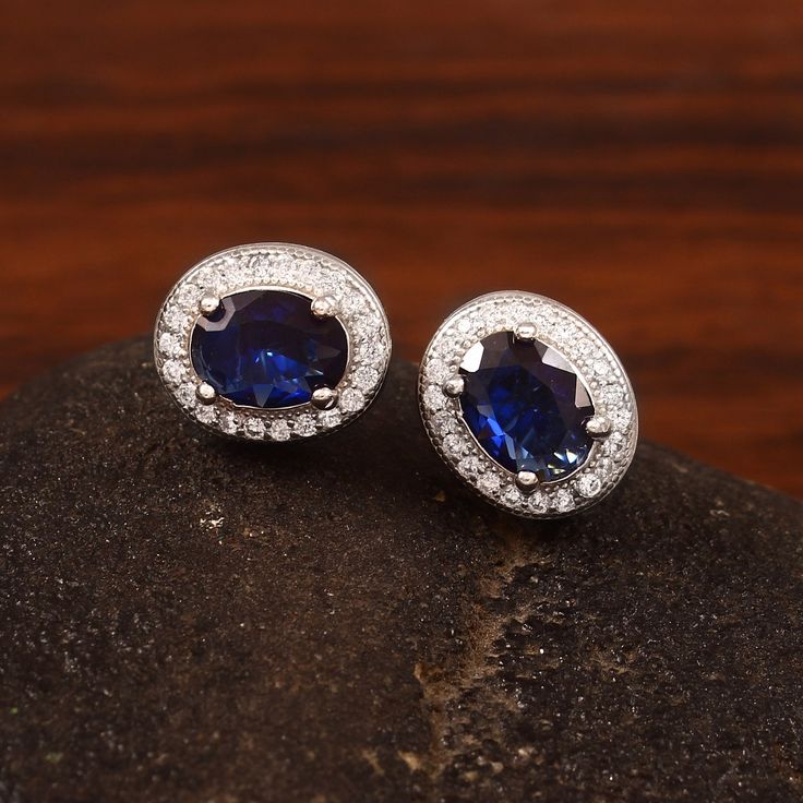 Please note: The product have lifetime warranty for the metal and gemstones used. We process gold and silver orders complete separately, so you can order with full confidence while ordering 14k gold products.  In case you need to ask anything before ordering, please do not hesitate to contact me.  Metal Type: 14k Solid gold ※ Stones: Simulated Blue Sapphire (5mm x 3mm) &  ※ Natural Diamonds (1.1mm Each) ※ Diamonds Details: Brilliant Cut Diamonds      SI Clarity and I-J Color.  ※ Accessories: *Sh Blue Sapphire Earrings, Halo Diamond Earrings, Sapphire And Diamond Earrings, Sapphire Studs, Halo Earrings, Halo Earrings Studs, Solid Gold Earrings, Sapphire Earrings, Dainty Earrings