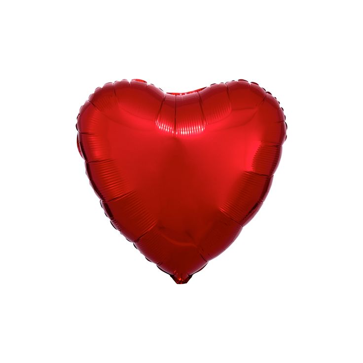 a red heart shaped balloon floating in the air