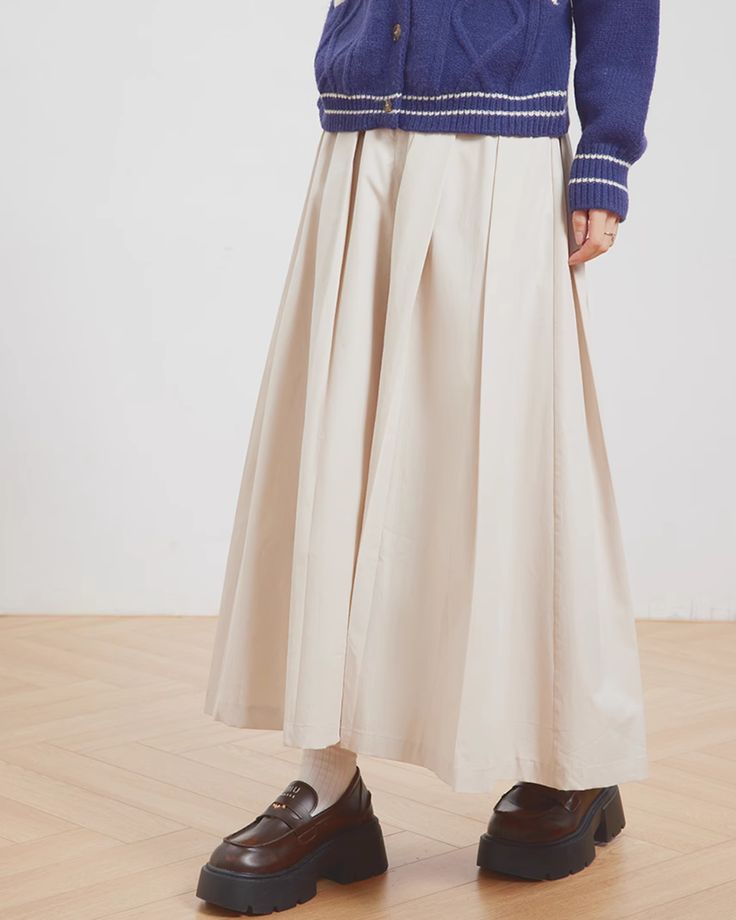 A maxi skirt with just the right amount of volume.

The material makes it look elegant and adds a casual feel.

A convenient item to have on hand.

◾️Model
Height/Weight：170cm(66.9in)/46kg(101.4lb)
Fitting Size：M

◾️Material
tencel 55%
cotton 45%





Size (cm)
Skirt Length
Waist
Hip


S
88
64
92


M
89
68
96


L
90
72
100 Baggy Solid Skirt For Fall, Spring Khaki Wide Leg Full-length Pants, Beige Pleated Full-length Bottoms, Spring Full Length Solid Color Skirt, Full Length Solid Color Spring Skirt, Spring Pleated Khaki Bottoms, Solid Color Relaxed Fit Maxi Skirt For Fall, Full-length Solid Cotton Skirt, Solid Color Long Pleated Skirt For Spring