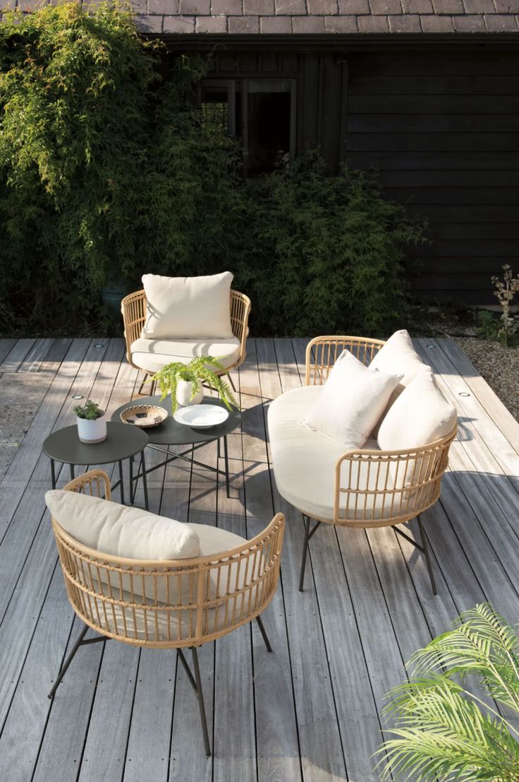 an outdoor furniture set on a wooden deck