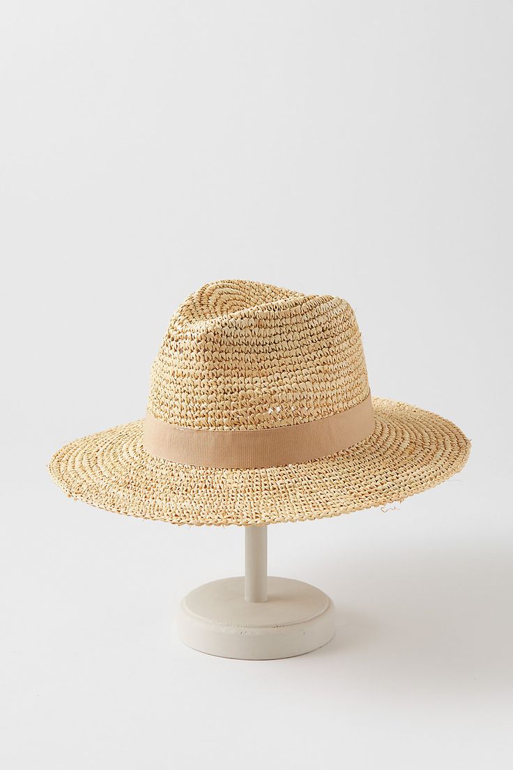 For a fresh summer look, head out with the Charlie safari hat as your finishing touch. Whether you're wearing a sundress or a linen shirt, you'll be ready for sun, sand, and socializing in this dapper design. Crafted from crocheted raffia, this lightweight hat features a grosgrain hatband with bow and an adjustable sweatband for all-day comfort. Summer Travel Sun Hat Made Of Toquilla Straw, Summer Coastal Straw Hat, Coastal Summer Straw Hat, Coastal Style Summer Straw Hat, Lightweight Coastal Straw Hat For Summer, Coastal Straw Sun Hat For Summer, Straw Coastal Sun Hat For Summer, Cream Panama Hat With Short Brim For Vacation, Cream Short Brim Panama Hat For Vacation