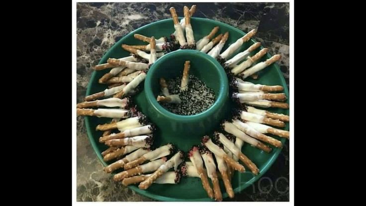 a green plate topped with lots of food on top of a table