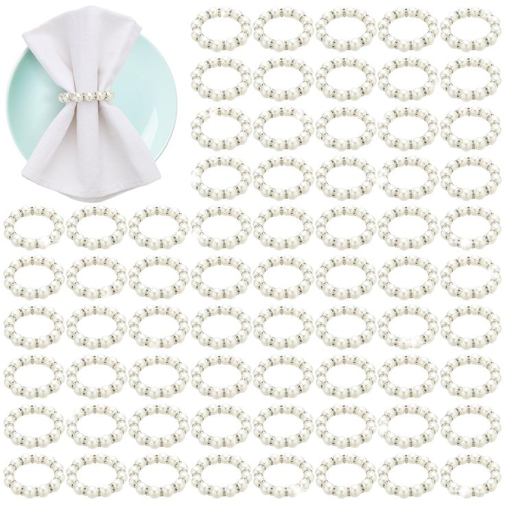 a plate and napkin with pearls on it