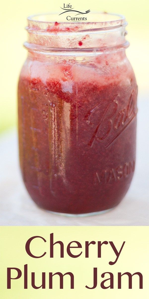 cherry plum jam in a mason jar on a table with text overlay that reads, cherry plum jam