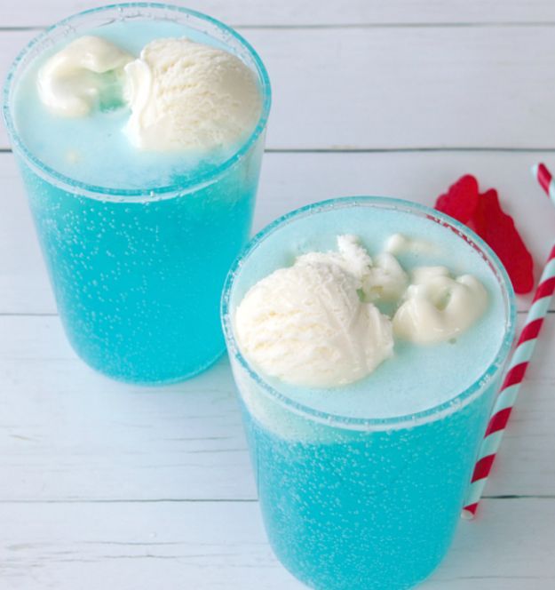 two glasses filled with ice cream on top of a table