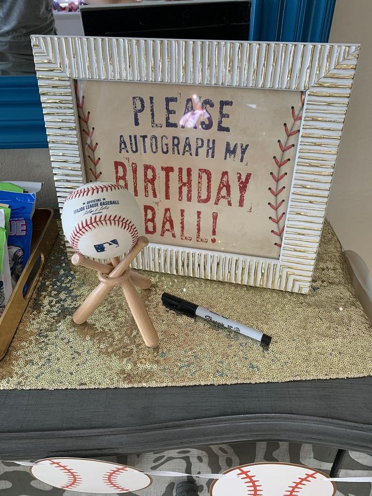 a baseball themed birthday party with cake and cupcakes on the plate holder, along with other items