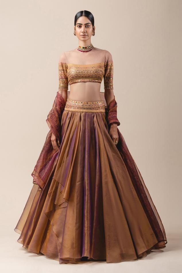 Pink and gold dual-tone organza draped lehenga paired with printed foil jersey blouse enhanced with sheer panel. Comes with sheer silk printed dupatta.
Component: 3
Embroidered, Printed
Neckline: Round
Sleeve Length: Half
Fabric: Organza, Silk, Foil Jersey
Color: Pink, Gold
Draped lehenga
Back keyhole
Sheer panel - Aza Fashions Draped Lehenga, Drape Lehenga, Gold Organza, Organza Lehenga, Tarun Tahiliani, Draped Skirt, Lehenga Designs, Designer Dress, Todays Outfit