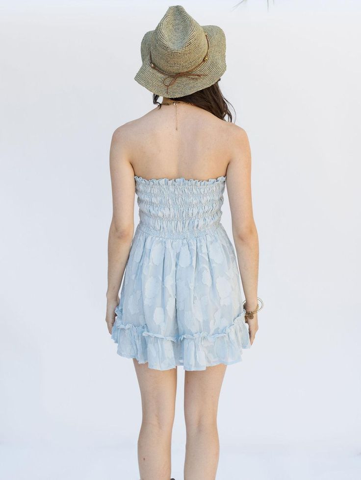 Step into sunshine with the Just Like Heaven Mini Dress in Cloud Blue. This strapless wonder features delicate smocking on soft, textured floral jacquard fabric, offering a perfect balance of comfort and chic. Whether styled casually with sneakers or dressed up with heels, this versatile mini captures the essence of breezy sunny days. Bandeau Mini Dress With Smocked Back For Beach, Beach Strapless Mini Dress With Smocked Bodice, Vacation Strapless Mini Dress With Smocked Bodice, Strapless Mini Dress With Smocked Bodice For Vacation, Strapless Summer Mini Dress With Smocked Back, Strapless Mini Dress With Smocked Back For Summer, Summer Dresses With Elastic Waistband For Garden Party, Fitted Strapless Dress With Smocked Bodice For Day Out, Summer Flowy Strapless Mini Dress