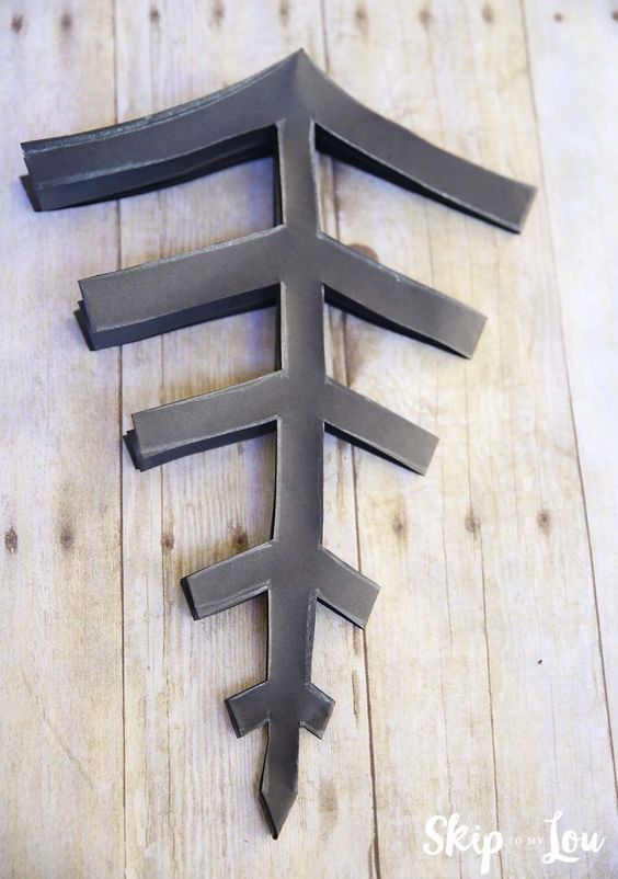 a piece of metal sitting on top of a wooden table