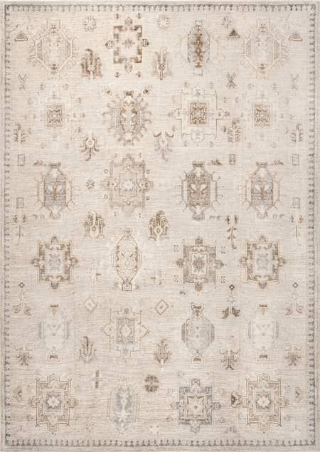 an area rug with various designs and colors on the floor, including beiges and browns