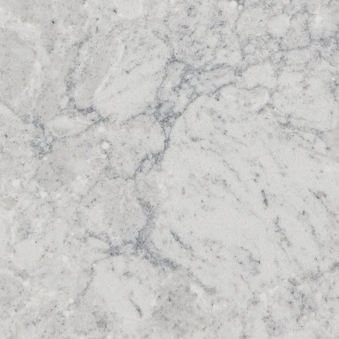 a white marble textured surface with grey veiners