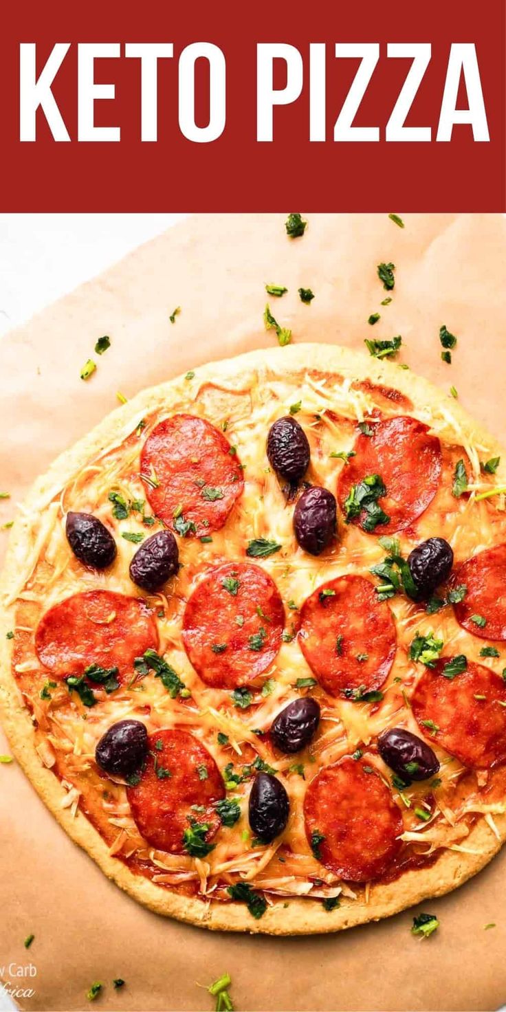 a close up of a pizza on a piece of paper with the words keto pizza