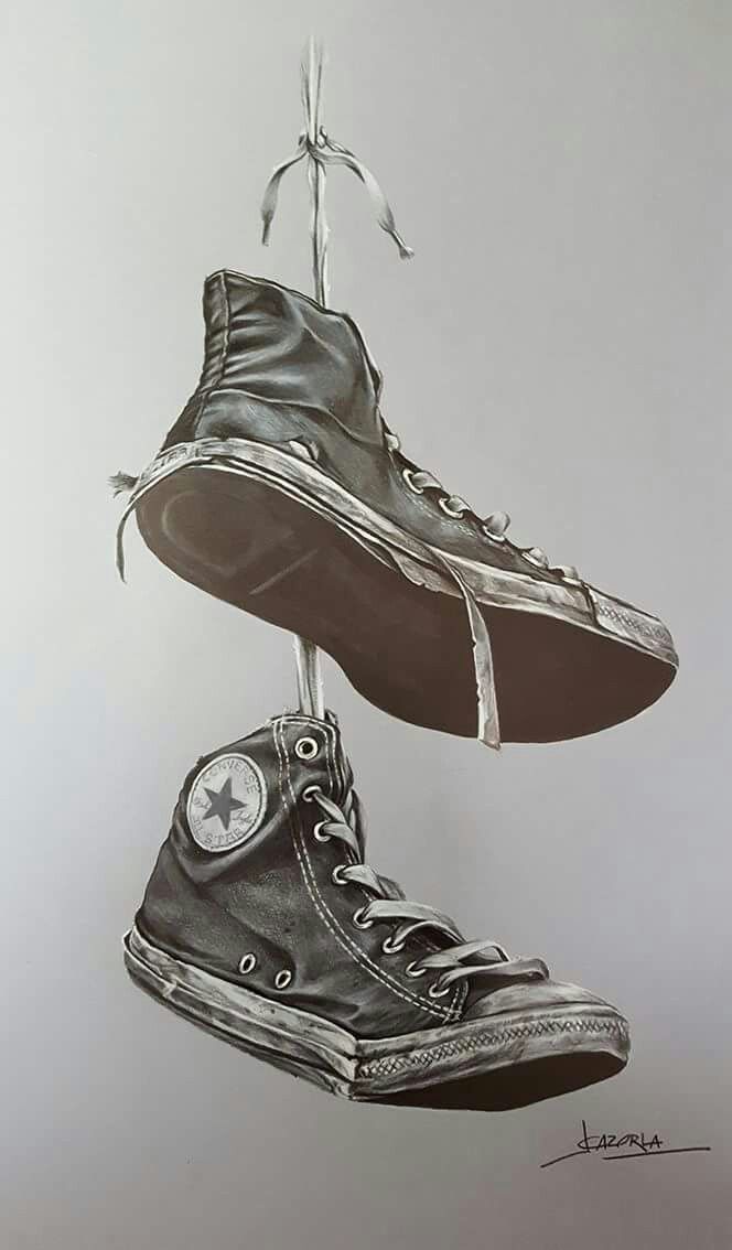 a drawing of two shoes hanging from strings