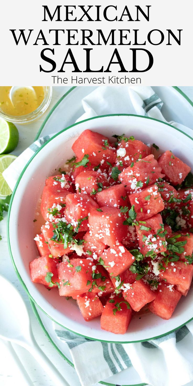 mexican watermelon salad in a bowl with limes and cilantro on the side