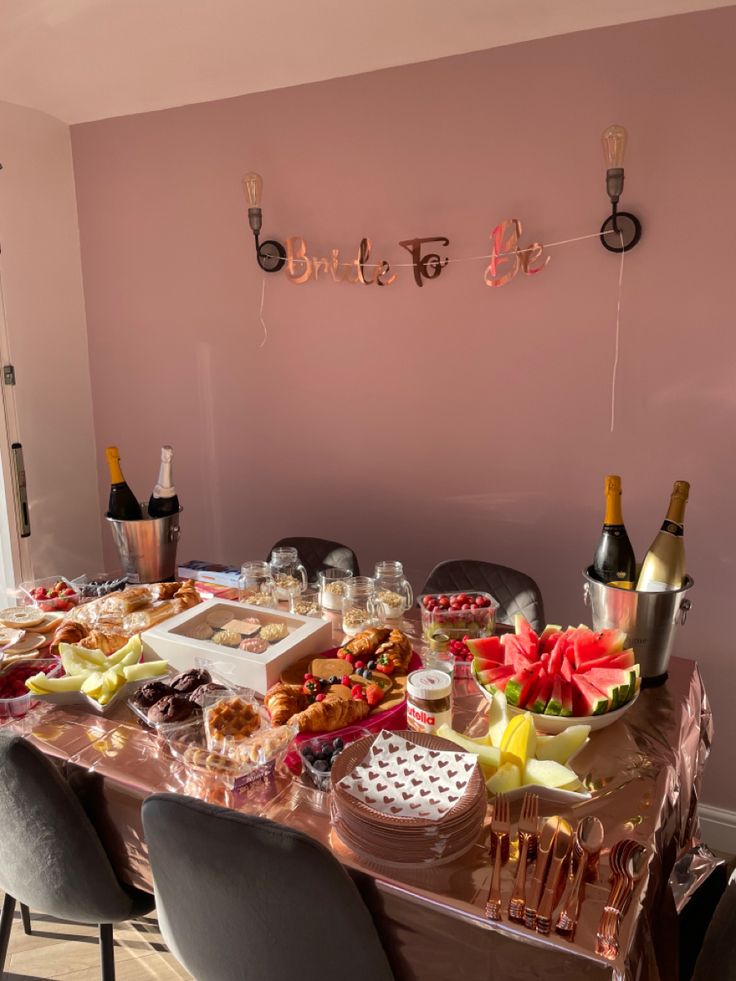 the table is covered with food and drinks for a brunch or dessert party