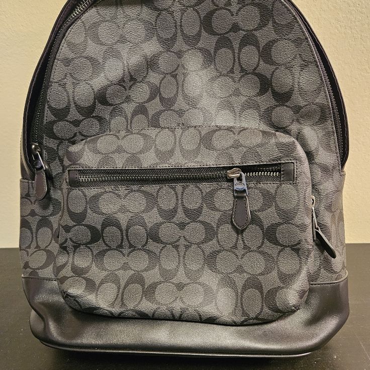 Coach (2736) West Charcoal Black Signature Coated Canvas Large Backpack Bookbag New Never Used With No Tags Black Backpack With Dust Bag For On-the-go, Classic Coach Backpack For School, Coach Black Leather Backpack For Everyday Use, Black Travel Backpack With Gunmetal Hardware, Coach School Backpack With Zipper Closure, Black Backpack With Gunmetal Hardware For Travel, Black Leather Backpack With Gunmetal Hardware, Coach Black Backpack, Black Coach Backpack With Removable Pouch