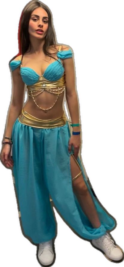 a woman in a blue and gold costume posing for the camera with her hands on her hips