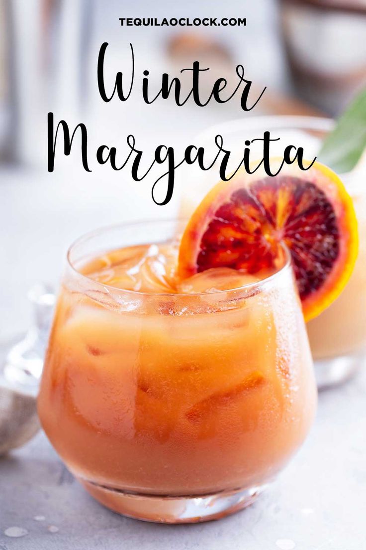 winter margarita with grapefruit and blood orange garnish in a glass on a table