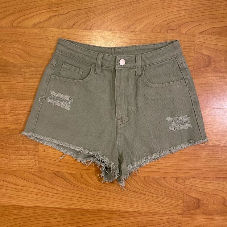 New With Tags Condition Womens Olive Green Distressed Denim High Waisted Shorts. Brand New Never Worn. Size Extra Small. Stretch High Rise Cotton Jean Shorts, High Rise Stretch Cotton Jean Shorts, Stretch High-rise Cotton Jean Shorts, Trendy Green Cutoff Jean Shorts, High Rise Green Denim Shorts, Trendy Green Denim Shorts, Green High Waist Bottoms With Frayed Hem, Green High-waisted Denim Jean Shorts, Trendy High Rise Cotton Jean Shorts