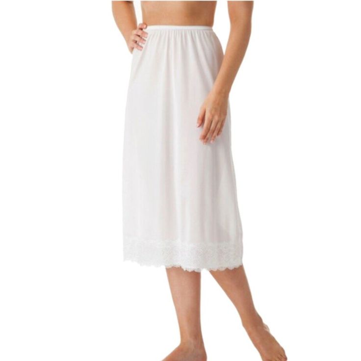 Elastic Waist Half Slip With Wide Lace Trim Hem Usa Fabric 100% Nylon Tricot 31″ Length Product Care: Machine Wash Warm With Like Colors. No Bleach. Tumble Dry Low. Warm Iron If Needed. A Classic Half Slip Embellished With A Stylish And Feminine Wide Lace Trim. Effortlessly Elegant, This Skirt Slip Flatters And Hugs The Body With Smooth Nylon Fabric. A Perfect Addition To A Long Dress Or Skirt! Available In Colors Beige, Black & White. White Classic Sleepwear For Spring, Seamless Summer Slip, White Sleeveless Daywear Slip, White Lace Trim Slip For Summer, Feminine Summer Slip For Daywear, Feminine Summer Daywear Slip, Fitted Slip For Daywear, Elegant White Stretch Sleepwear, Summer Lace Slip For Daywear