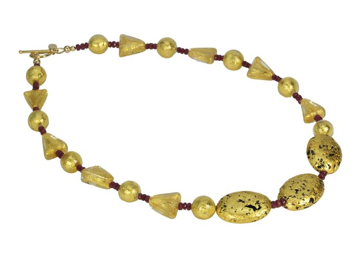 "Ruby and Gustav" NecklaceModern, elegant, yet reminiscent of a Klimt painting during the Art Nouveau period. "The Kiss" or "Lady in Gold" (portrait of Adele Bloch-Bauer) is inspiration for this ruby and gold necklace. "Ruby and Gustav" is designed with crystal 24 Karat gold foil triangle and round Venetian lampwork glass beads, dazzling natural dark red faceted African rubies (60 in all), hand-gilded 23-Karat gold on lava stone, finished with 14-Karat Gold-Filled toggle clasp and my signature t Luxury Gold Beaded Necklace For Party, Luxury Gold Beaded Formal Necklaces, Luxury Gold Beaded Necklaces For Formal Occasions, Luxury Gold Beads Necklace For Formal Occasions, Luxury Formal Gold Beaded Necklaces, Luxury Silver Temple Necklace, Elegant Gold Single Strand Custom Necklace, Elegant Gold Single Strand Necklace, Gold Single Strand Necklace For Formal Occasions