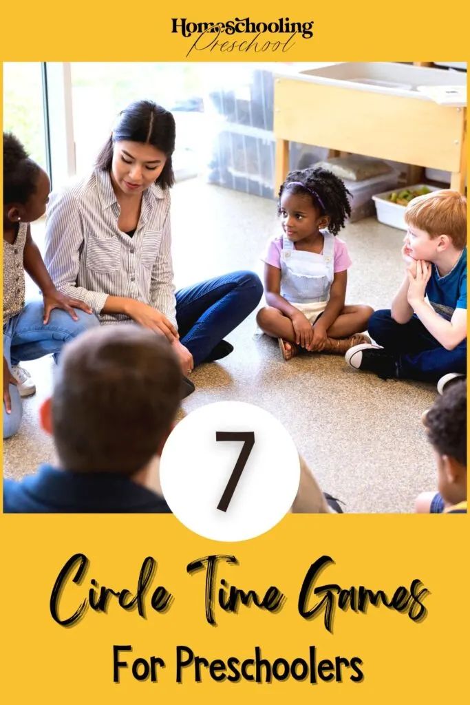 a group of children sitting on the floor in front of a yellow frame with text that reads