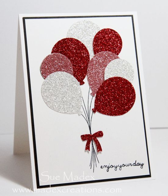 a card with red and white balloons on it