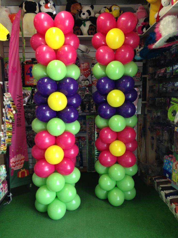 the balloon columns are decorated with multicolored balloons