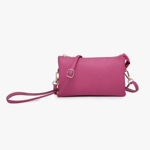 The Riley bag is one of our top sellers. This crossbody/clutch has two major compartments with one middle zipper pocket and a top zipper closure. Inside are two slip pockets and six cardholders. Wear it as a crossbody or use it as a clutch! Includes a detachable wristlet strap and an adjustable shoulder strap. Made of vegan leather. Dimensions: 8"L x 1.5"D x 5"H Colors may vary on different viewing devices Versatile Crossbody Clutch, Zipper Pouch Crossbody Phone Bag, Trendy Crossbody Clutch With Zipper Closure, Versatile Crossbody Clutch With Zipper Pouch, Crossbody Clutch, Zipper Pocket, Vegan Leather, Card Holder, Shoulder Strap