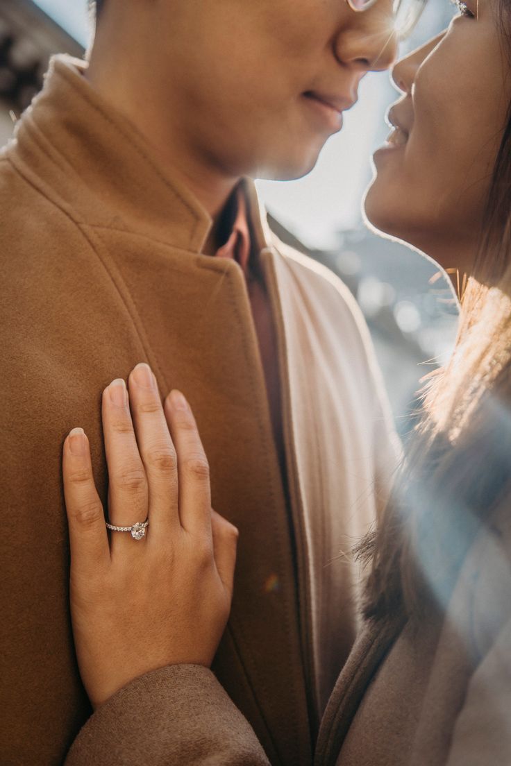 a man and woman standing next to each other