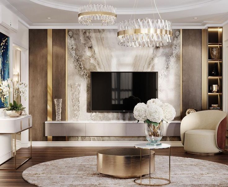 an elegant living room with white flowers and gold accents