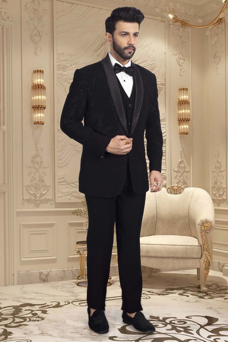 This TUXEDO- R14-S63 showcases stunning black cutdana embroidery, adding a touch of elegance and sophistication to your ensemble. Expertly crafted with precision and attention to detail, this tuxedo is the perfect choice for any formal occasion. Its intricate design is sure to make you stand out in the crowd. Black Tuxedo For Black-tie Gala, Black Tuxedo For Black-tie Gala Events, Black Tuxedo For Gala Evening, Classic Black Tuxedo For Gala, Black Tuxedo For Wedding And Gala Events, Black Blazer For Black-tie Gala Events, Luxury Black Blazer For Black Tie Events, Black Tailored Suits For Gala, Black Evening Suits For Gala