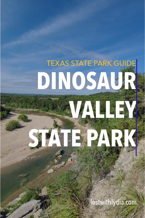 the text texas state park guide dinosaur valley state park on a blue sky day with trees and water