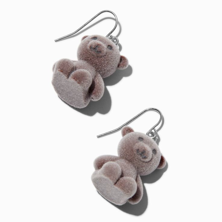 two teddy bears are hanging from silver earwires, one is pink and the other is gray