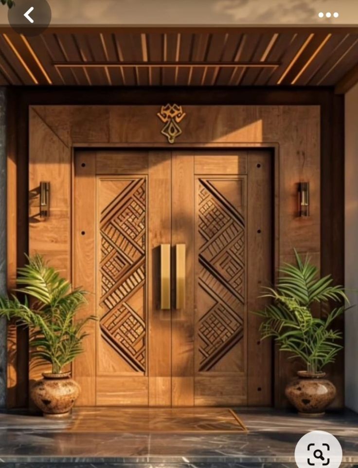 a wooden door with two planters on either side