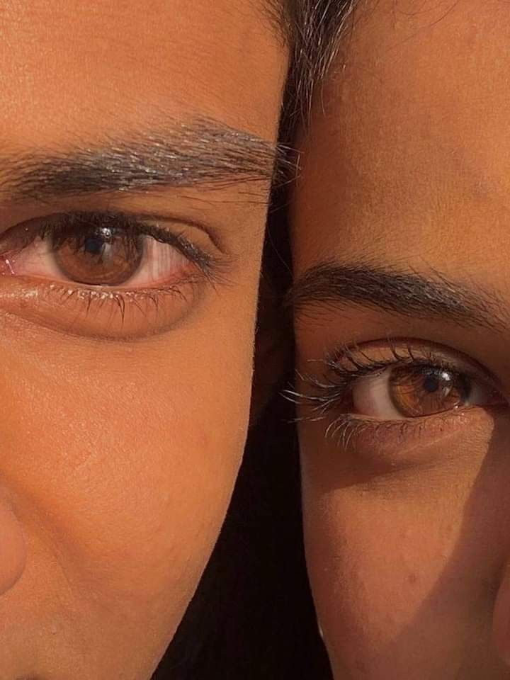 two people with brown eyes looking in the same direction