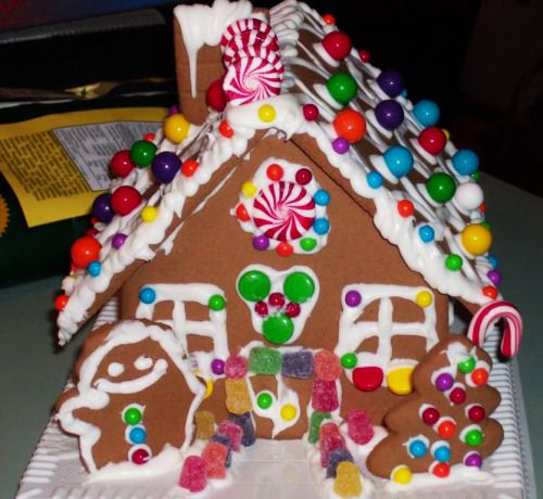 a gingerbread house decorated with candy and candies