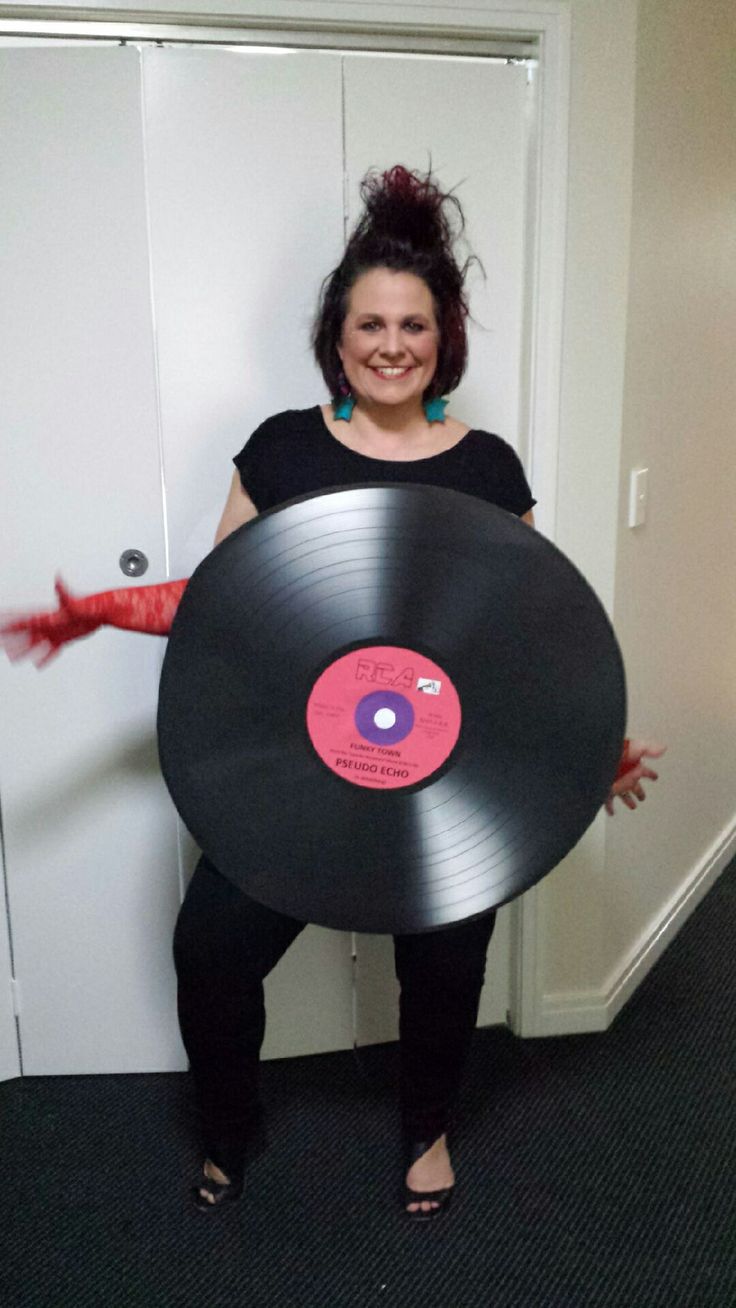 a woman holding a record in her hands