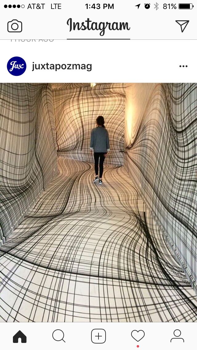 an instagram page with a woman walking through a tunnel in the middle of it