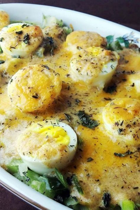 an egg and spinach casserole in a white dish